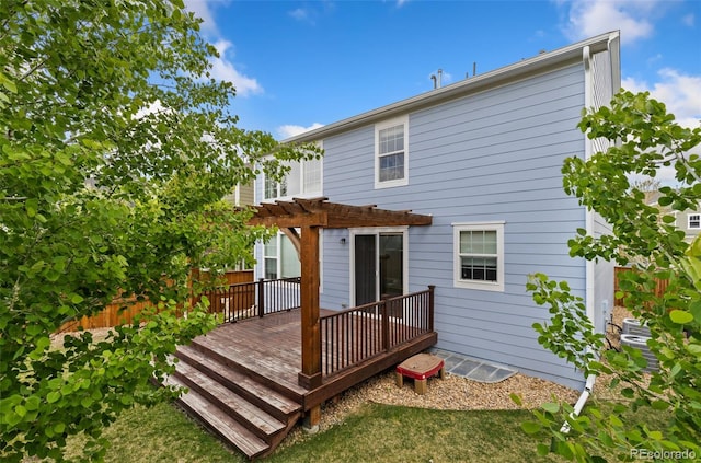 back of house featuring a pergola and a deck