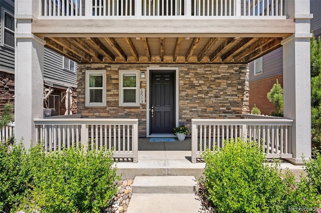12714 E Dickenson Ave, Aurora, CO 80014 - entrance to property with covered porch and stone siding