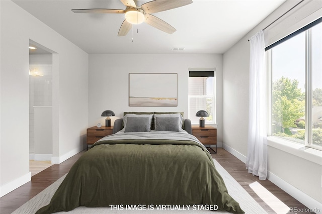 12714 E Dickenson Ave, Aurora, CO 80014 - bedroom featuring wood finished floors and ceiling fan
