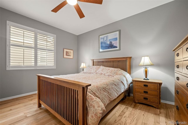 bedroom featuring wood finished floors, ceiling fan, and baseboards