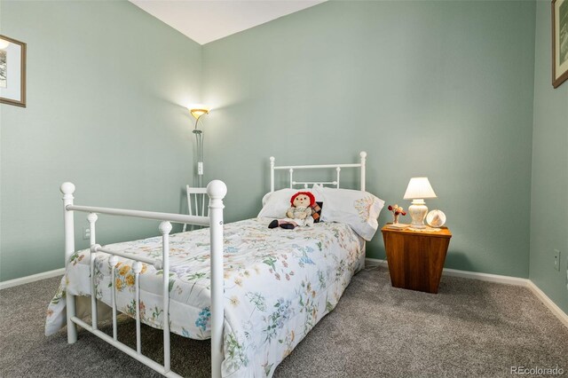 bedroom with baseboards and carpet floors