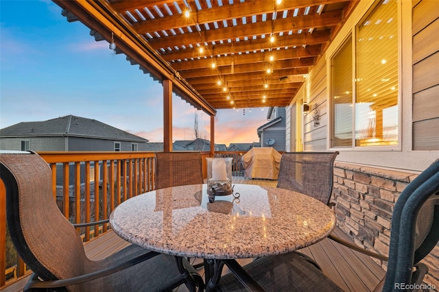deck with a pergola, outdoor dining area, and grilling area