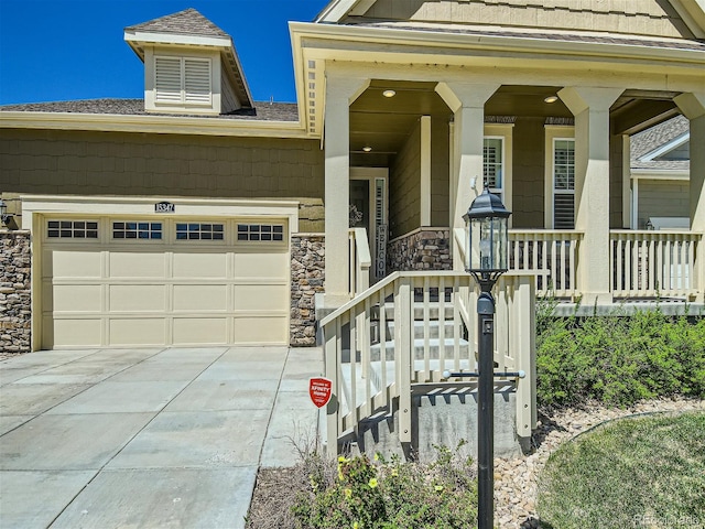 15347 Quince Cir, Thornton, CO 80602 - view of front of home featuring stone siding, driveway, a garage, covered porch, and roof with shingles