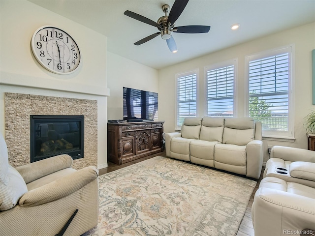 15347 Quince Cir, Thornton, CO 80602 - living room with wood finished floors, ceiling fan, a high end fireplace, and recessed lighting