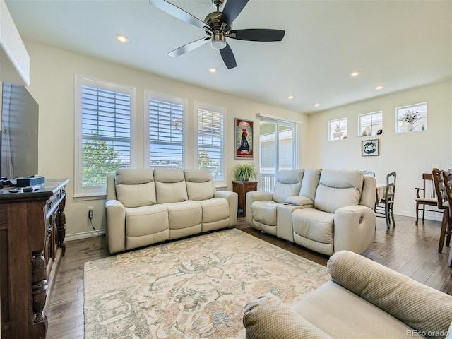 15347 Quince Cir, Thornton, CO 80602 - living area with plenty of natural light, ceiling fan, wood finished floors, recessed lighting, and baseboards