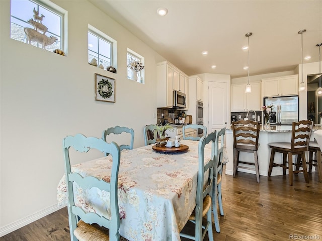 15347 Quince Cir, Thornton, CO 80602 - dining space featuring dark wood-style floors, recessed lighting, and baseboards
