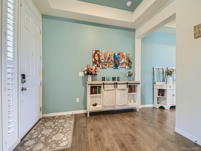 15347 Quince Cir, Thornton, CO 80602 - foyer featuring wood finished floors, baseboards, and a raised ceiling