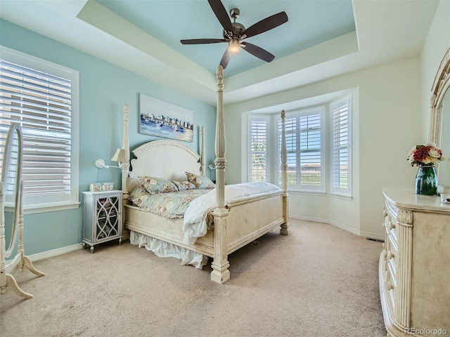 15347 Quince Cir, Thornton, CO 80602 - carpeted bedroom with a raised ceiling, baseboards, and ceiling fan