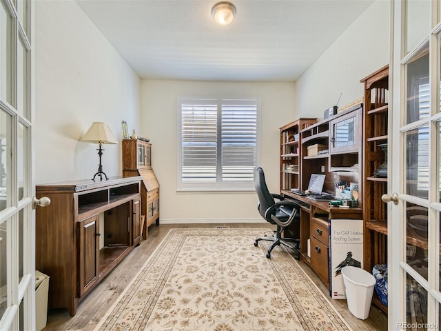 15347 Quince Cir, Thornton, CO 80602 - office space featuring light wood-type flooring and french doors