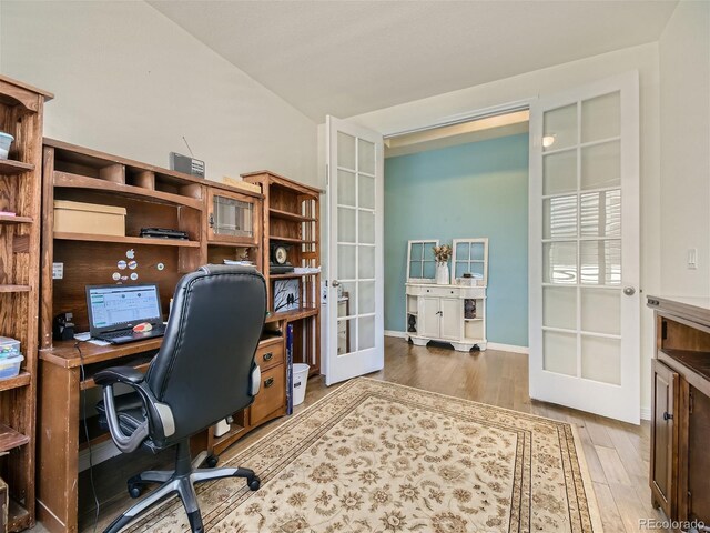 15347 Quince Cir, Thornton, CO 80602 - home office featuring french doors, wood finished floors, and baseboards
