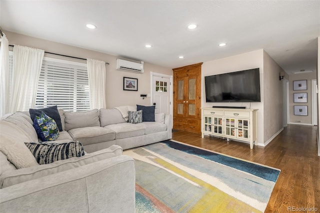 living room with a wall mounted AC and dark hardwood / wood-style flooring