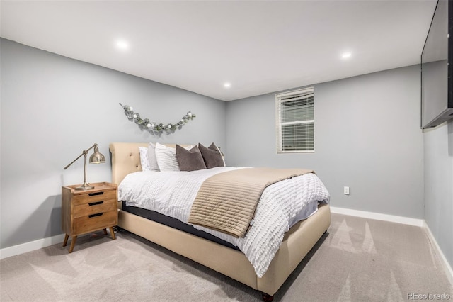 bedroom with light colored carpet