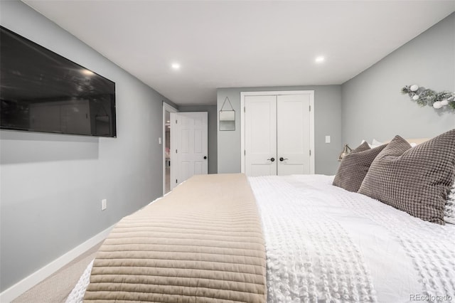 carpeted bedroom with a closet