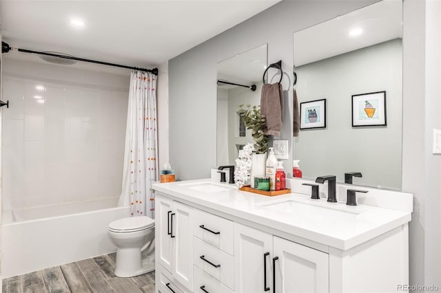 full bathroom featuring vanity, toilet, and shower / bath combo with shower curtain