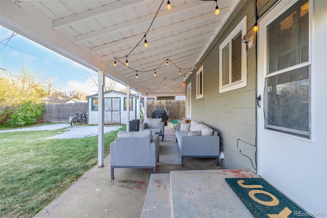 view of patio featuring a storage unit and an outdoor living space