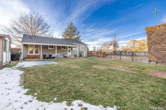 rear view of property with a patio area and a yard