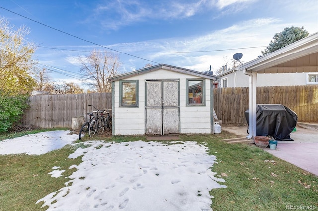 view of outbuilding featuring a lawn