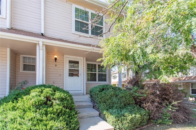 property entrance with covered porch