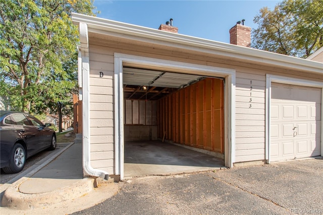 garage featuring wooden walls