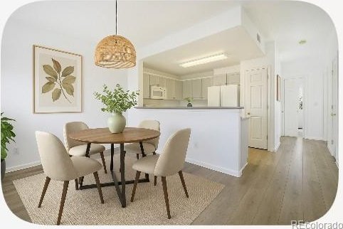 2644 Devonshire Ct, Denver, CO 80229 - dining area featuring light wood finished floors and baseboards
