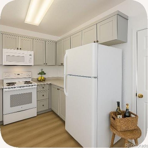 2644 Devonshire Ct, Denver, CO 80229 - kitchen with white appliances, light wood-style flooring, light countertops, and gray cabinets