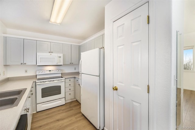 2644 Devonshire Ct, Denver, CO 80229 - kitchen with white appliances, light wood finished floors, and light countertops