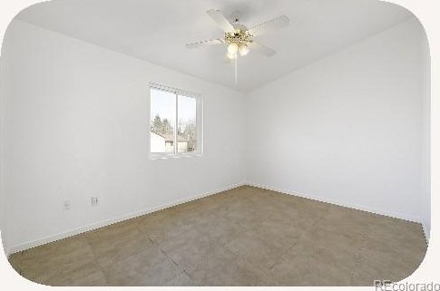 2644 Devonshire Ct, Denver, CO 80229 - empty room with arched walkways and a ceiling fan