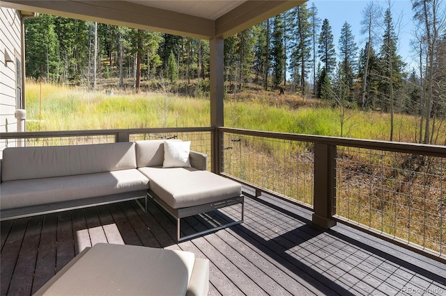 wooden terrace with outdoor lounge area