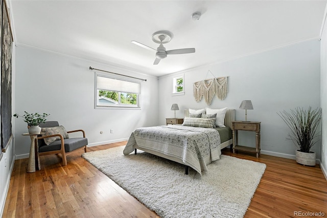 3608 S Newport Way, Denver, CO 80237 - bedroom featuring crown molding, wood finished floors, and ceiling fan