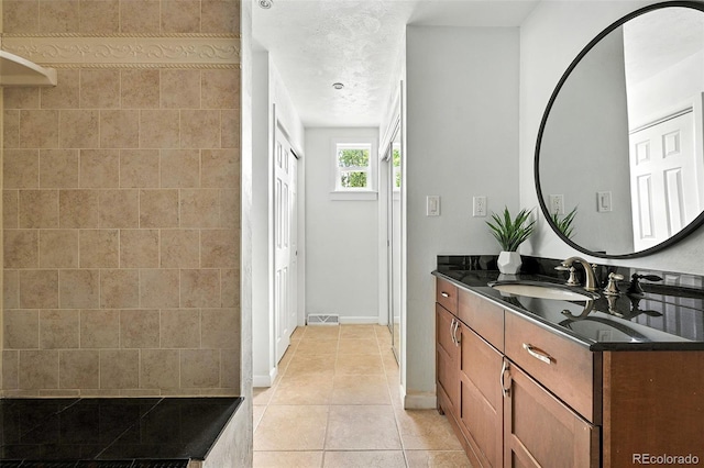 3608 S Newport Way, Denver, CO 80237 - bathroom with vanity and tile patterned floors