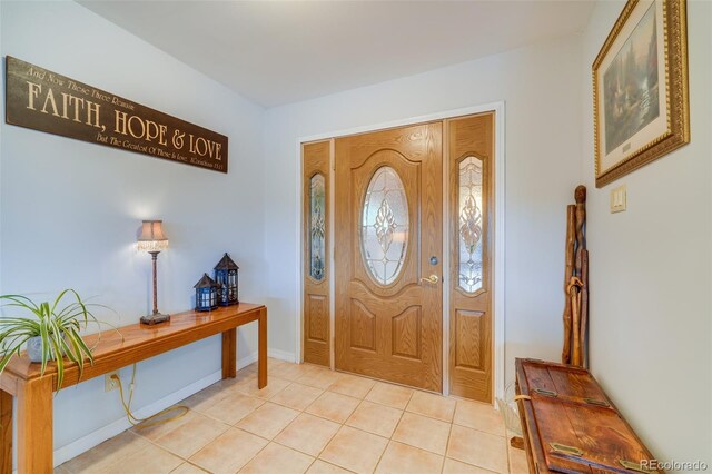 foyer featuring light tile patterned floors