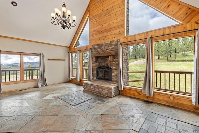 181 Sawmill Rd, Loveland, CO 80537 - unfurnished living room with stone tile flooring, plenty of natural light, a chandelier, and high vaulted ceiling