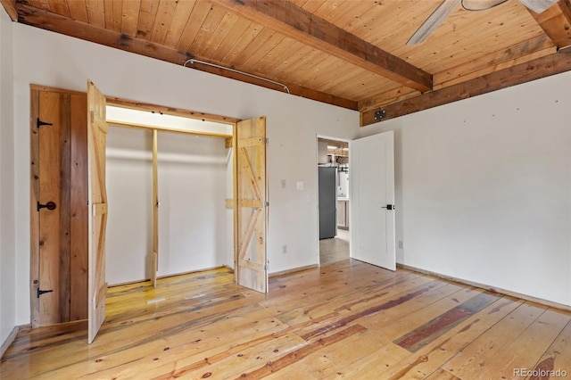181 Sawmill Rd, Loveland, CO 80537 - unfurnished bedroom with wooden ceiling with exposed beams, hardwood / wood-style floors, and a closet