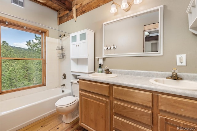 181 Sawmill Rd, Loveland, CO 80537 - full bath featuring double vanity, beamed ceiling, shower / tub combination, toilet, and wood finished floors