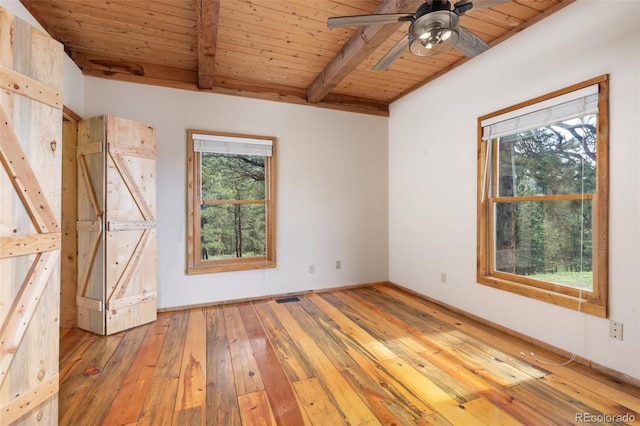 181 Sawmill Rd, Loveland, CO 80537 - empty room featuring wood ceiling with exposed beams, light wood-type flooring, and a ceiling fan