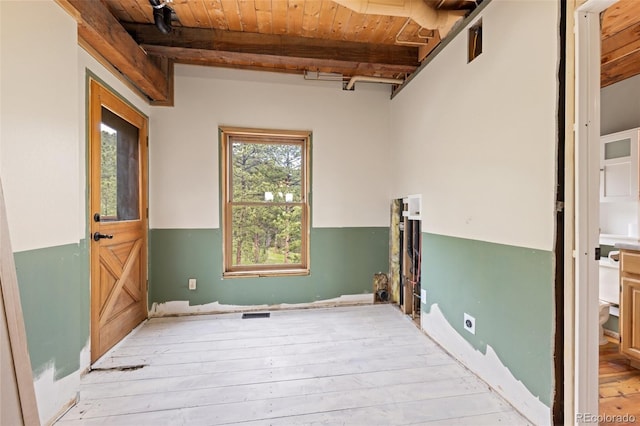 181 Sawmill Rd, Loveland, CO 80537 - laundry room featuring electric dryer hookup, wooden ceiling, and light wood-style floors