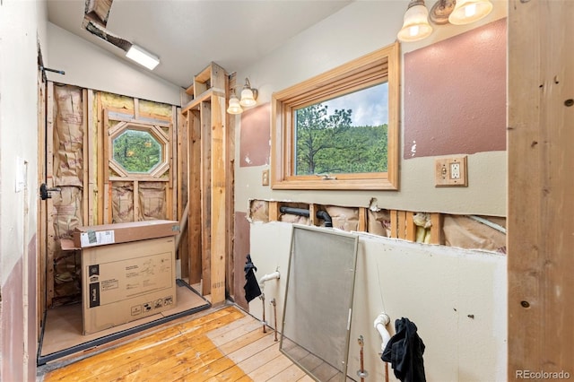 181 Sawmill Rd, Loveland, CO 80537 - bathroom with hardwood / wood-style floors, plenty of natural light, and vaulted ceiling