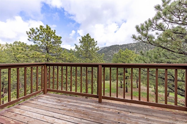 181 Sawmill Rd, Loveland, CO 80537 - wooden terrace featuring a view of trees