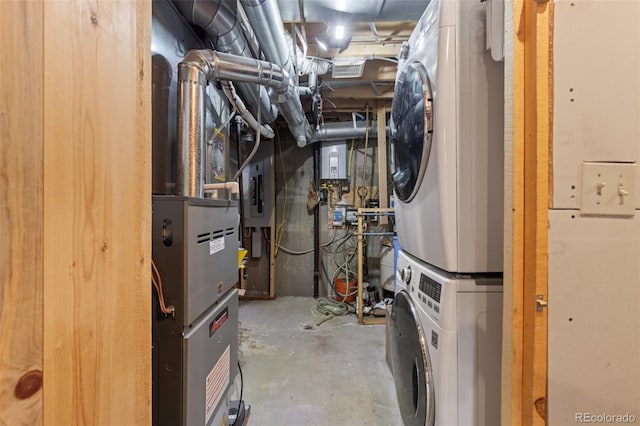 181 Sawmill Rd, Loveland, CO 80537 - utilities with stacked washer / dryer, electric panel, and water heater