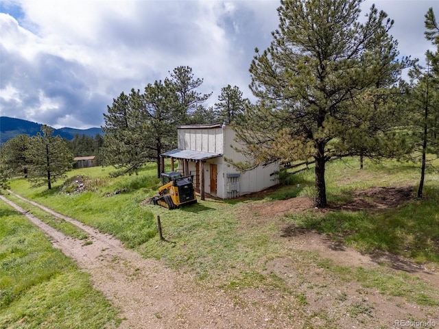 181 Sawmill Rd, Loveland, CO 80537 - view of yard featuring a mountain view and an outbuilding