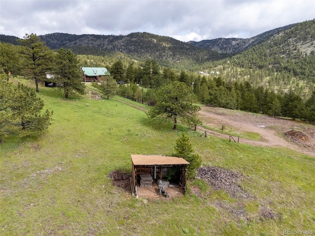 181 Sawmill Rd, Loveland, CO 80537 - view of mountain backdrop with rural landscape and a heavily wooded area