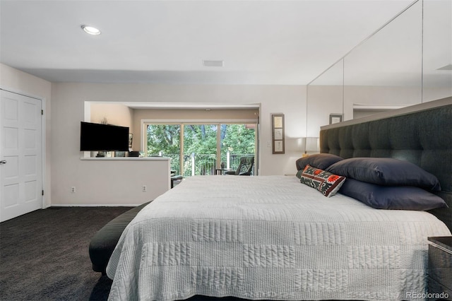 2601 S Quebec St Unit 11, Denver, CO 80231 - carpeted bedroom featuring access to exterior and baseboards