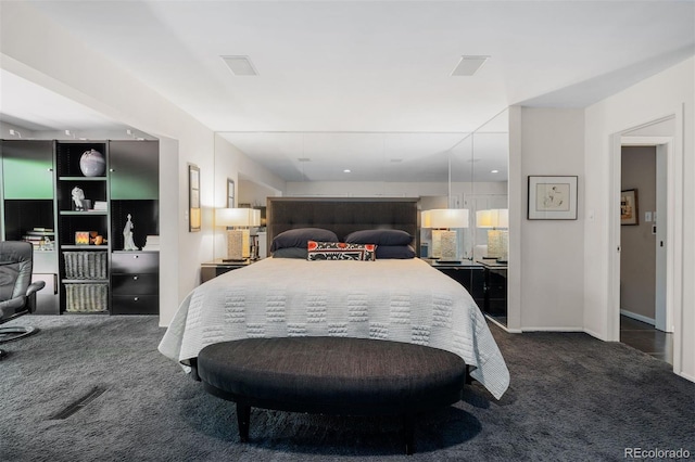 2601 S Quebec St Unit 11, Denver, CO 80231 - bedroom with dark colored carpet