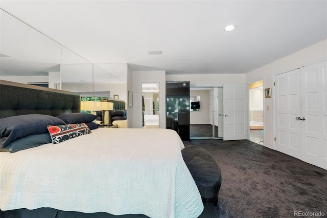 2601 S Quebec St Unit 11, Denver, CO 80231 - bedroom featuring dark carpet, ensuite bathroom, and recessed lighting