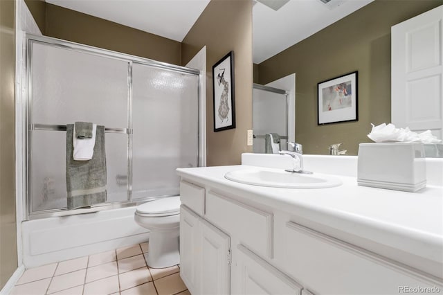 2601 S Quebec St Unit 11, Denver, CO 80231 - bathroom with tile patterned flooring, vanity, and combined bath / shower with glass door
