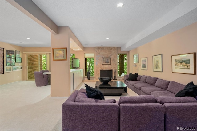 2601 S Quebec St Unit 11, Denver, CO 80231 - carpeted living area featuring recessed lighting, a fireplace, and a textured ceiling