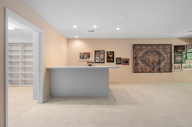 2601 S Quebec St Unit 11, Denver, CO 80231 - indoor bar featuring light carpet, recessed lighting, and a textured ceiling