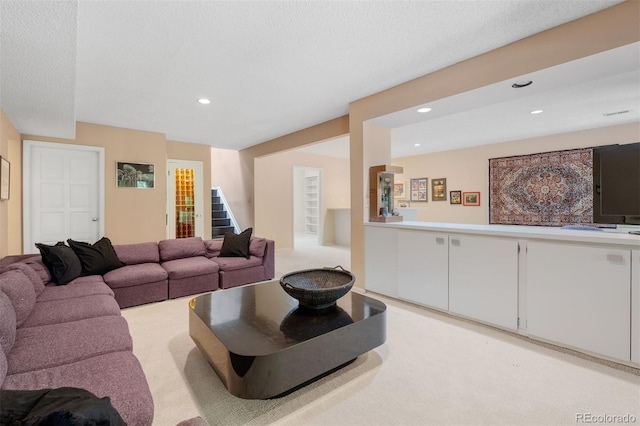 2601 S Quebec St Unit 11, Denver, CO 80231 - living room with stairway, recessed lighting, a textured ceiling, and light carpet