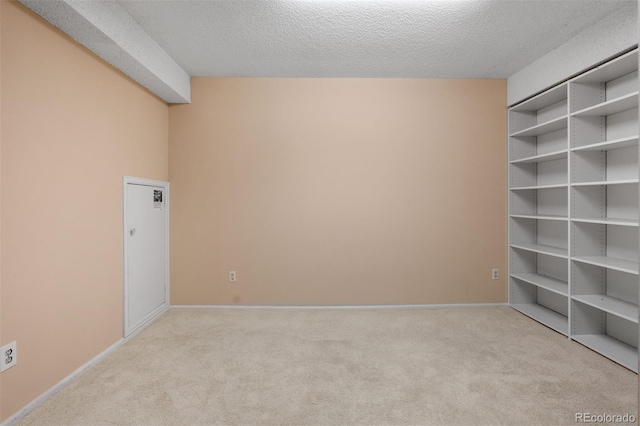 2601 S Quebec St Unit 11, Denver, CO 80231 - spare room with carpet flooring and a textured ceiling