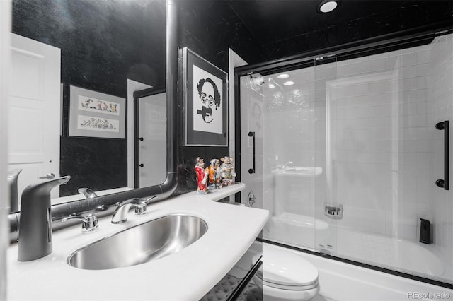 2601 S Quebec St Unit 11, Denver, CO 80231 - full bath with shower / bath combination with glass door and vanity